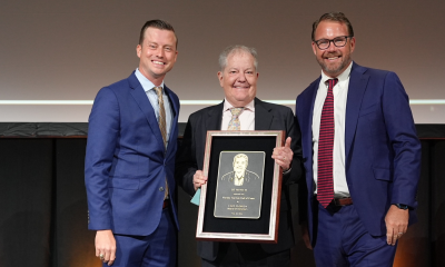 DT Minich with Bryan Griffin and Chip Wile following Minich's 2026 induction into the Florida Tourism Hall of Fame in West Palm Beach.