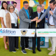 Representatives from Addition Financial, Rosen Preschools, the Early Learning Coalition of Orange County and Junior Achievement of Central Florida participate in a ribbon-cutting ceremony for the ADDing FUNdamentals financial literacy program.